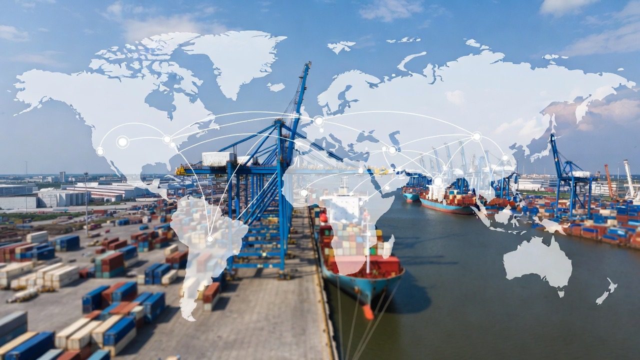 Aerial view of a container port with cranes and vessels